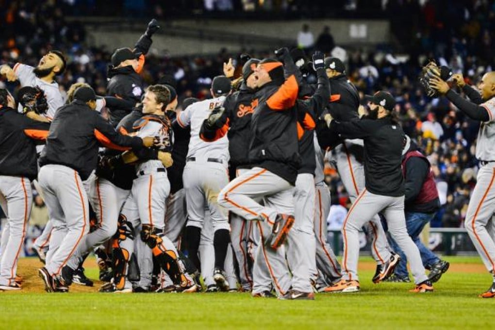 Members of the San Francisco Giants celebrate after winning game four of the World Series at Comerica Park. Photo: EPA
