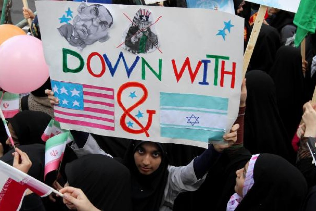 A demonstrator takes part in a rally outside Tehran's former US embassy on Thursday, to mark the 33rd anniversary of compound's seizure by Islamist students. Photo: AFP