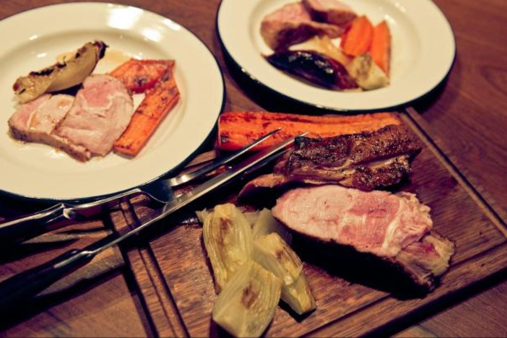 Pork knuckle with roasted vegetables at The Salted Pig