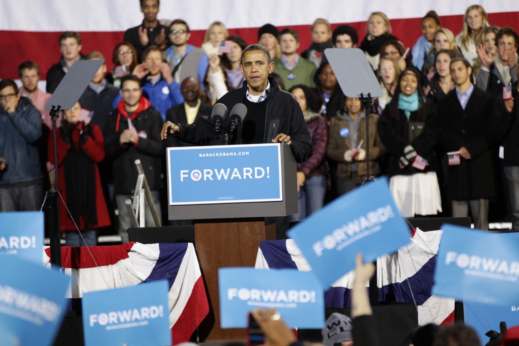 President Barack Obama pauses during a speech at a campaign rally at the Community College of Aurora, in Aurora, Colorado. Photo: AP