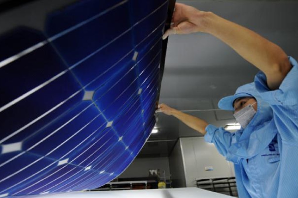 A worker produces solar module, for export to Europe, at a company in Taizhou City, east China's Zhejiang province. Photo: Xinhua