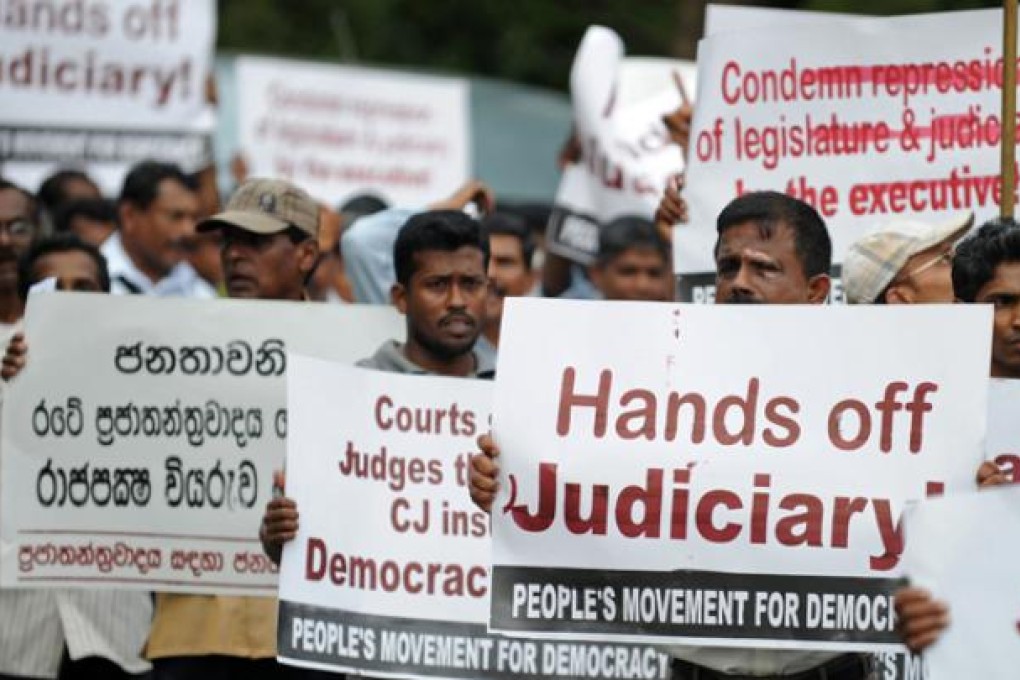 Sri Lankan lawyers and opposition activists demonstrate outside the Supreme Court in Colombo on Monday. Photo: AFP