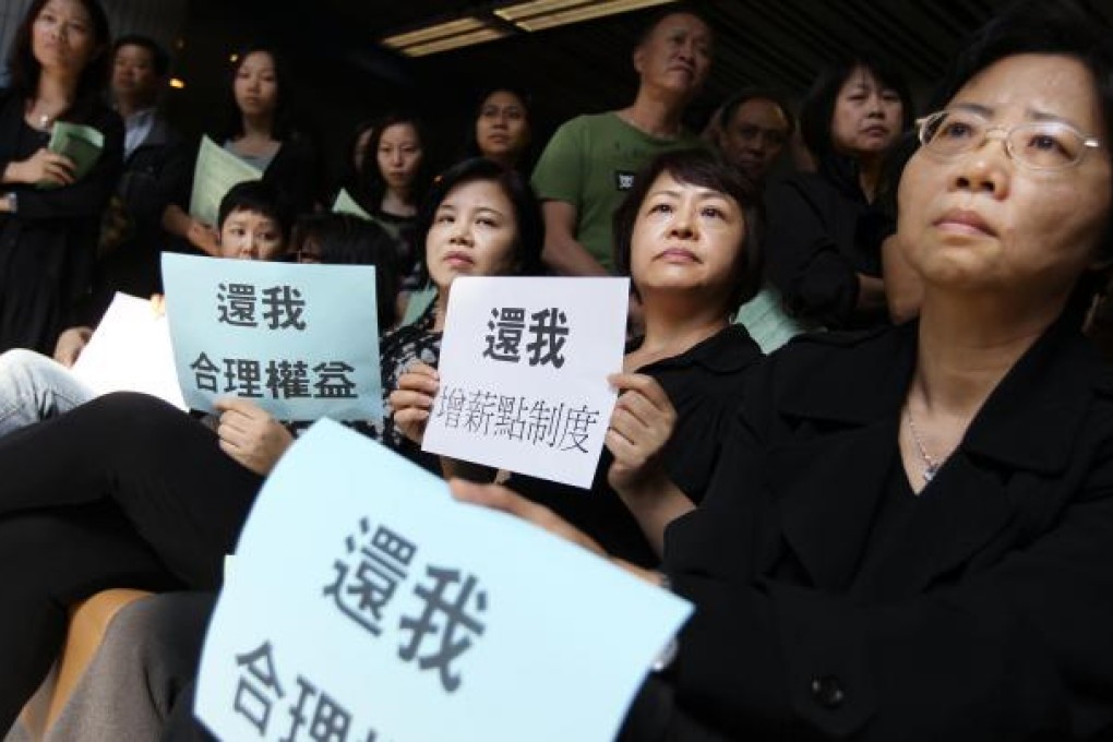 CityU staff protest changes to pay structure. Photo: Sam Tsang