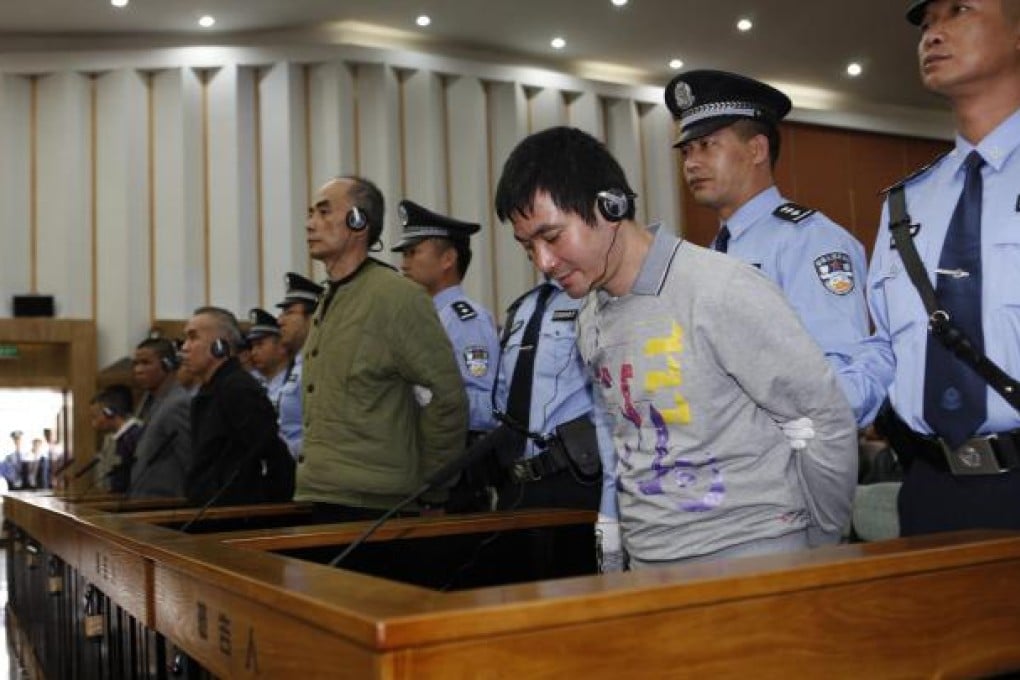 Drug lord Naw Kham (right) and his five accomplices as the verdicts were announced in Kunming, Yunnan province, yesterday. Photo: Xinhua