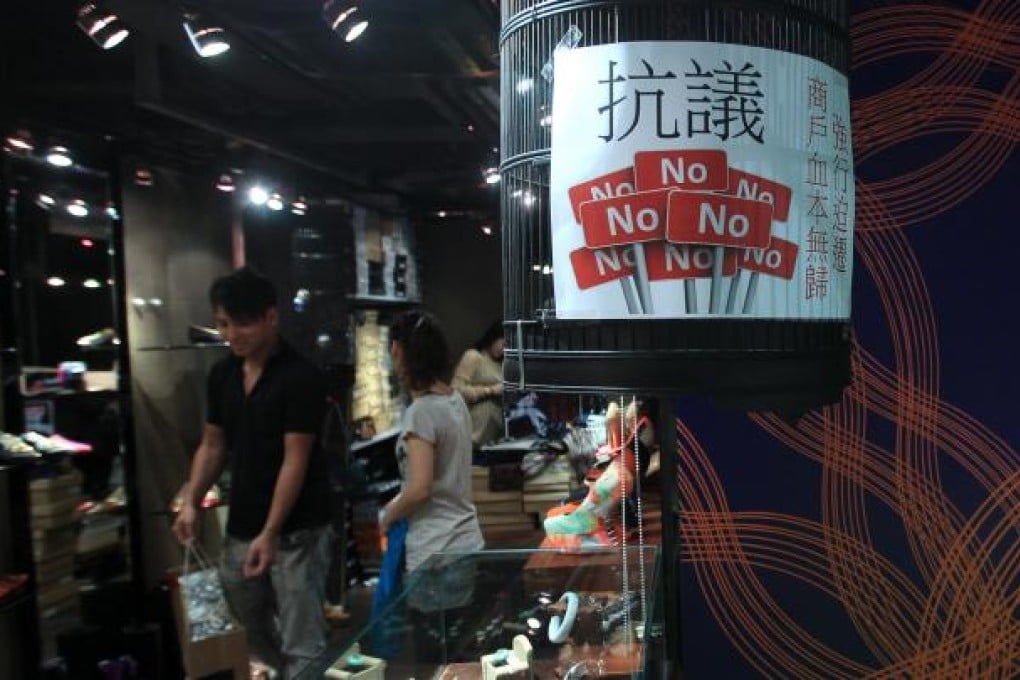 Protest posters at the DNA Galleria in Tsim Sha Tsui. Tenants are protesting over the new owner kicking them out. Photo: Jonathan Wong