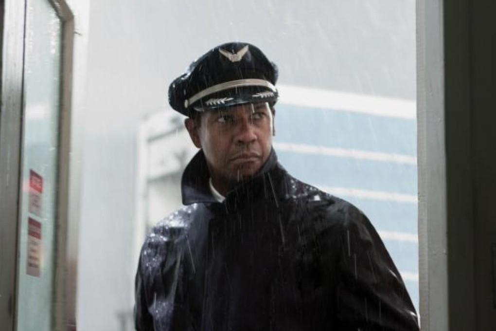 Flight features Denzel Washington portraying Whip Whitaker, a whiz in the cockpit despite being inebriated and drugged up much of the time. Photo: AP