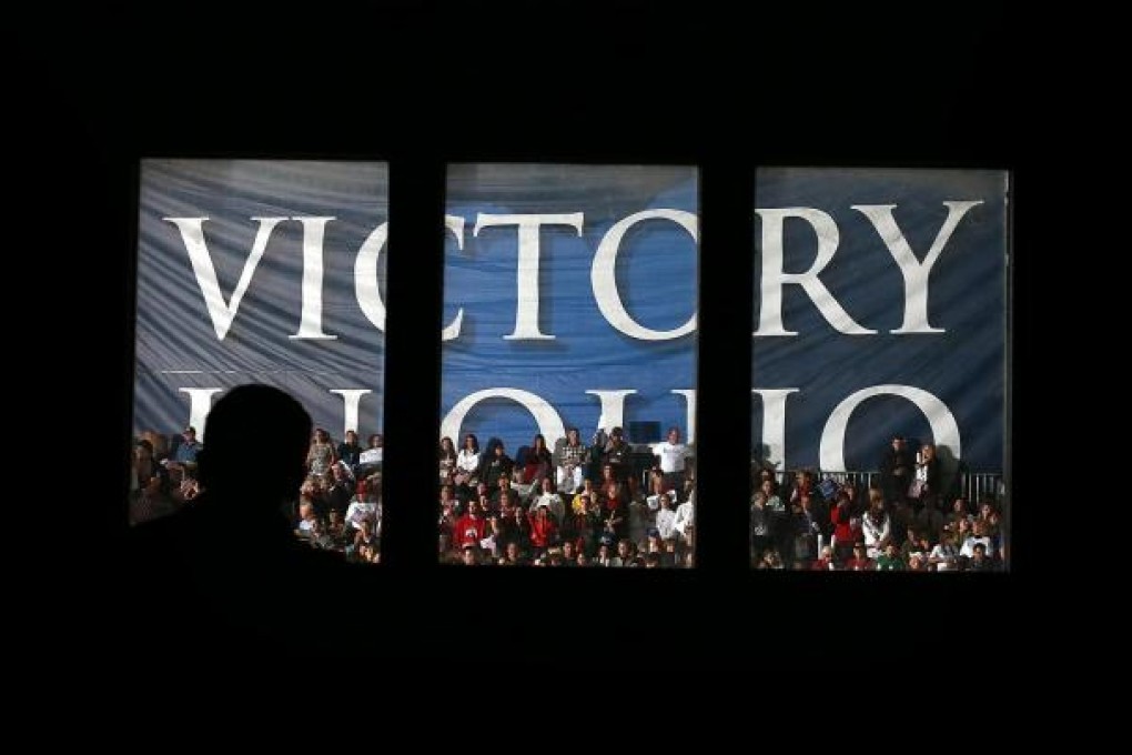 Mitt Romney eyes "Victory in Ohio" at a Columbus rally. Photo: AFP.