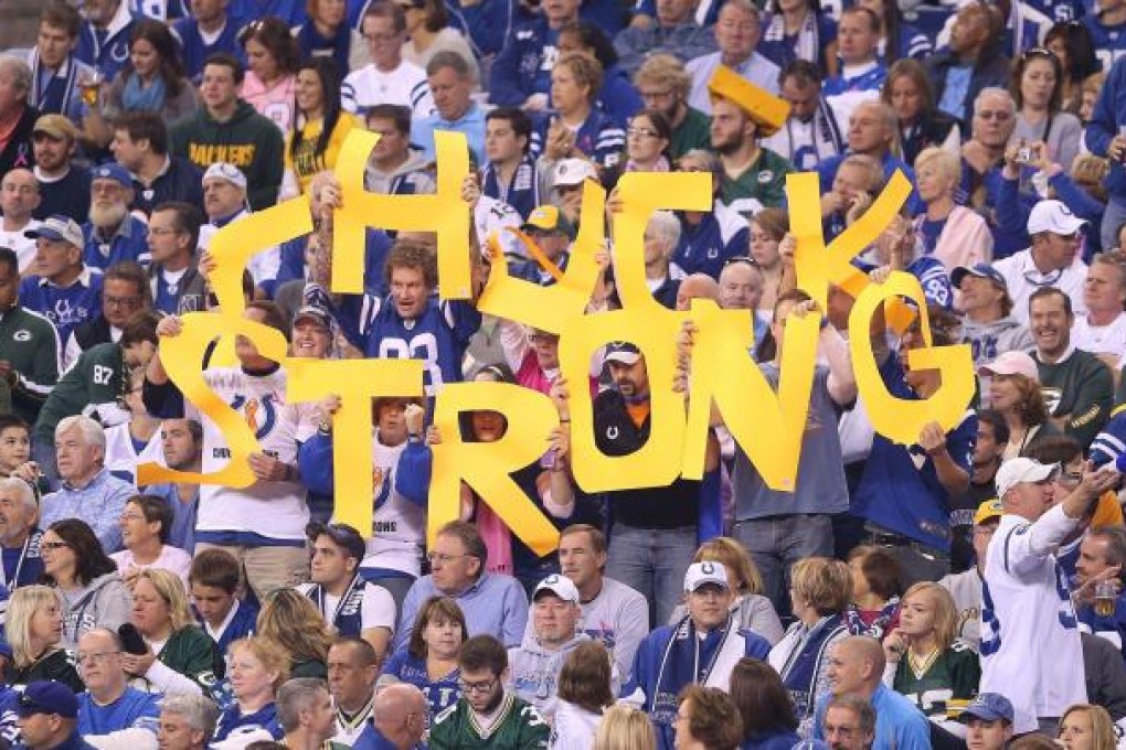 Indianapolis Colts fans hold up a sign to show their support for head coach Chuck Pagano.