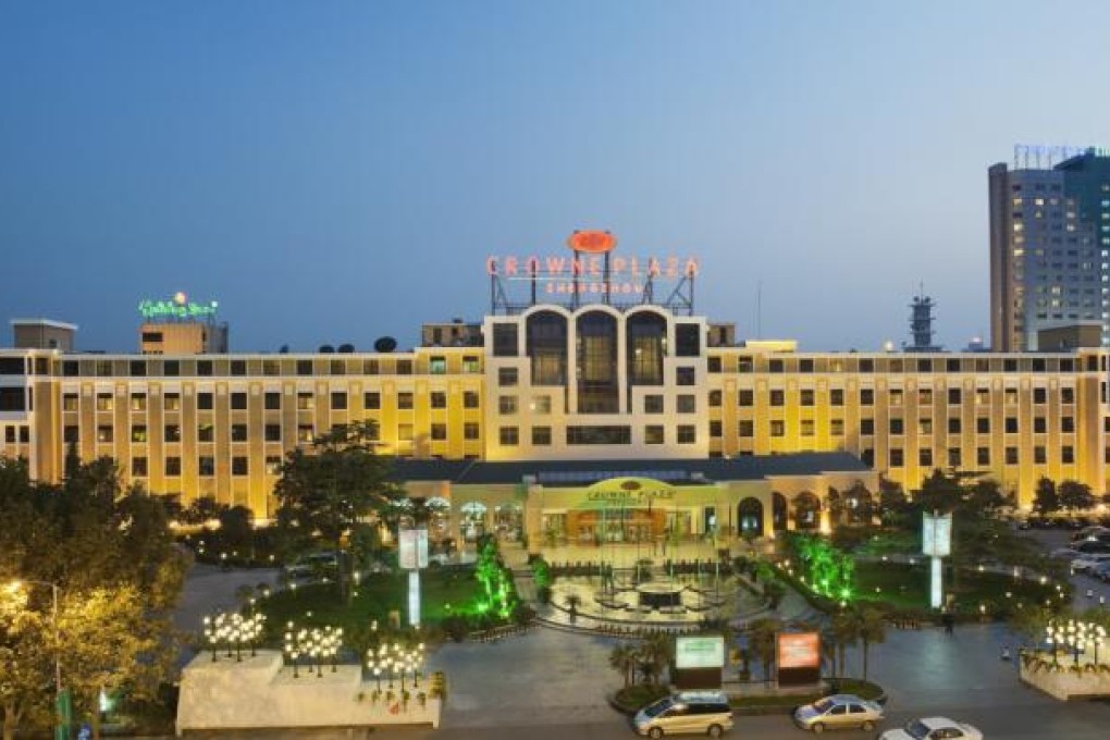 The complex housing the Crowne Plaza, Holiday Inn and Holiday Inn Express boasts extensive landscaping and used to be a government state house.