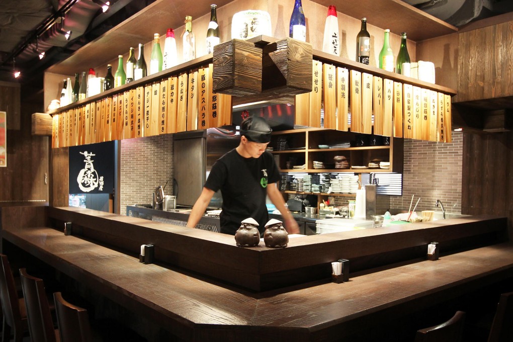 Counter seating around the open kitchen.Photos: Dickson Lee