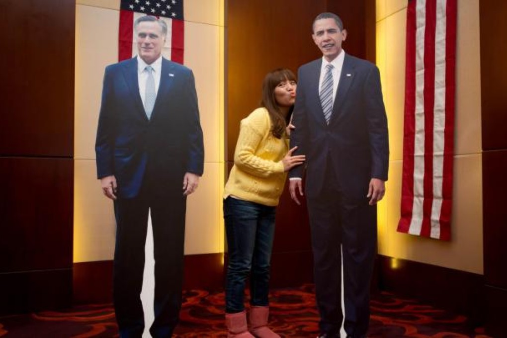 A woman casts her own personal vote at an elections event organised by the US embassy in Beijing yesterday. Photo: AFP