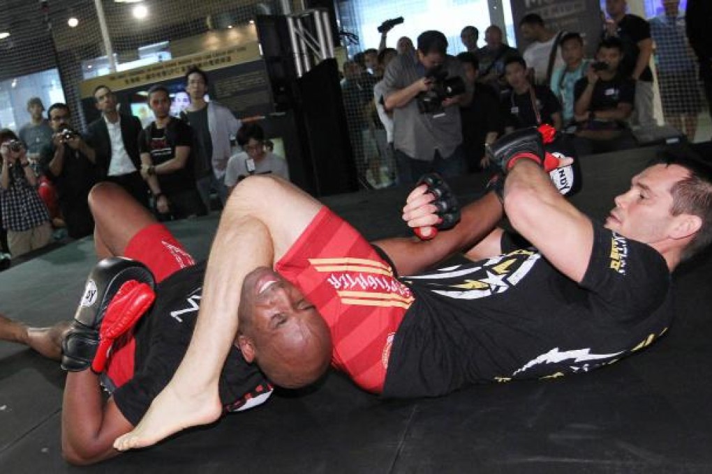Rich Franklin (right), former UFC middleweight champion, shows sparring techniques ahead of the Macau event. Photo: Nora Tam