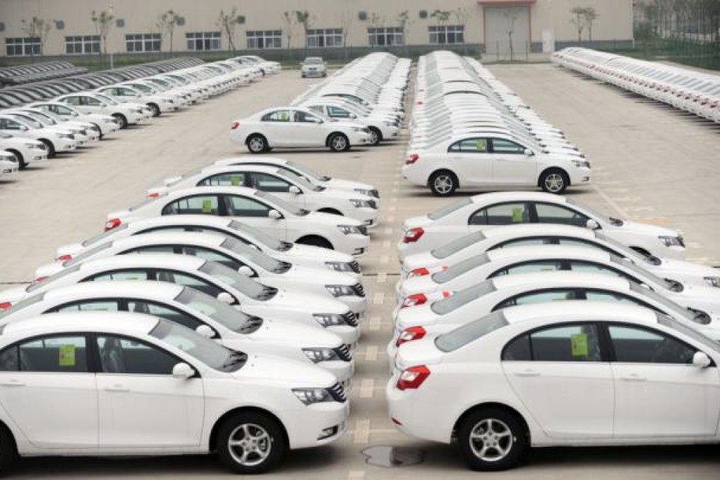 Rows of Emgrand cars are parked at Geely's car plant in Hangzhou, the marque's global headquarters.