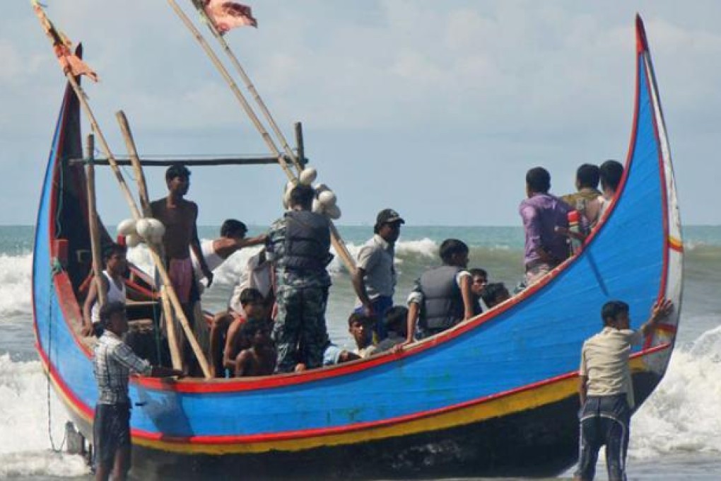 Bangladesh Border Guard soldiers check survivors rescued from a boat that capsized in Teknaf, Bangladesh, on Wednesday. Photo: AP