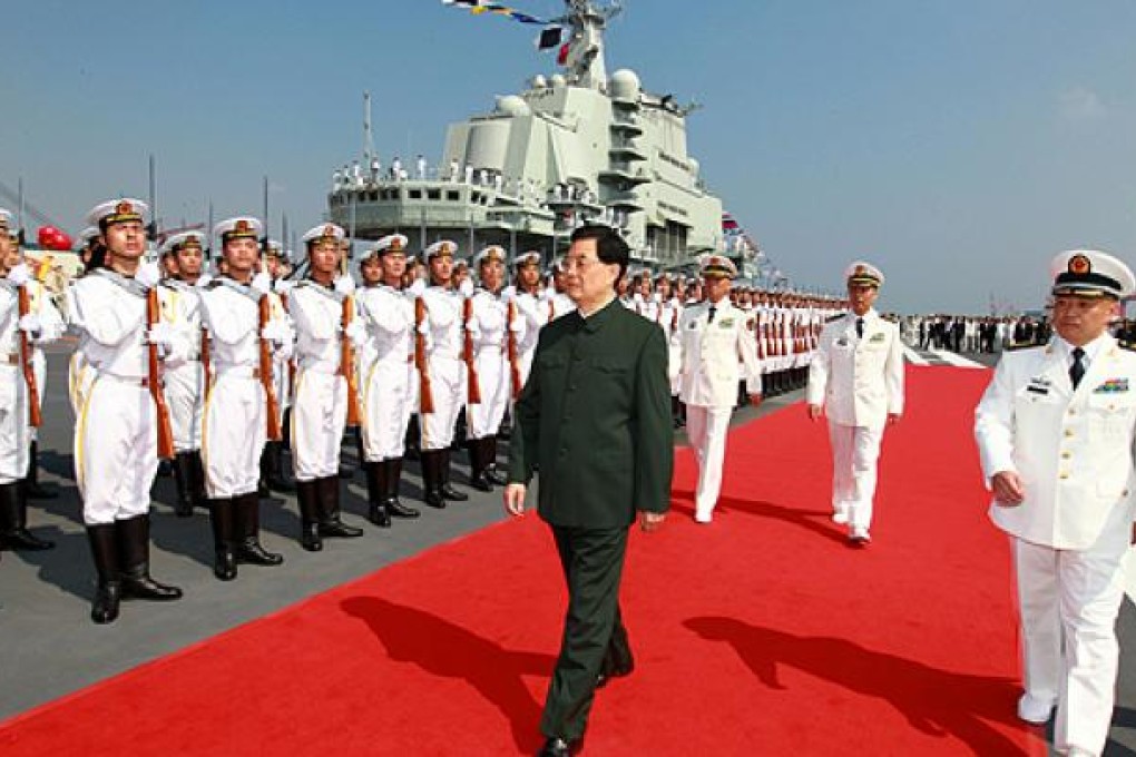 President Hu Jintao inspects the navy on aircraft carrier Liaoning at a naval base in Dalian in September. Photo: AP