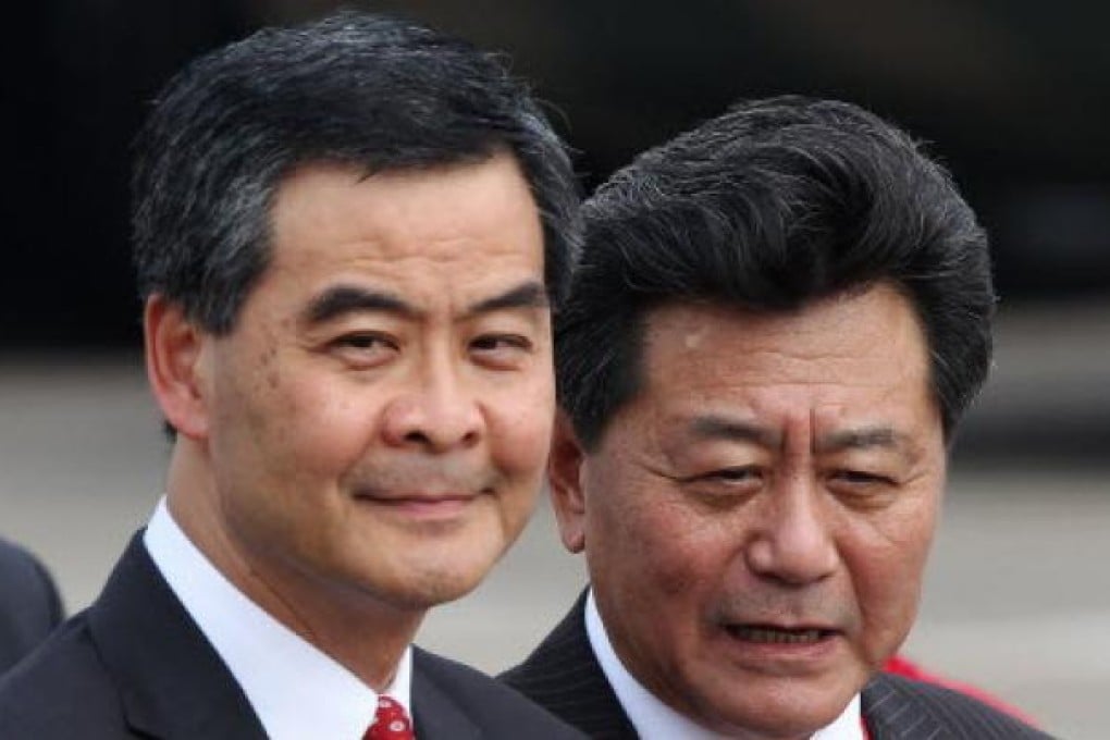 Li Gang (right) said Beijing had no plans to replace Chief Executive Leung Chun-ying (left). Photo: Nora Tam