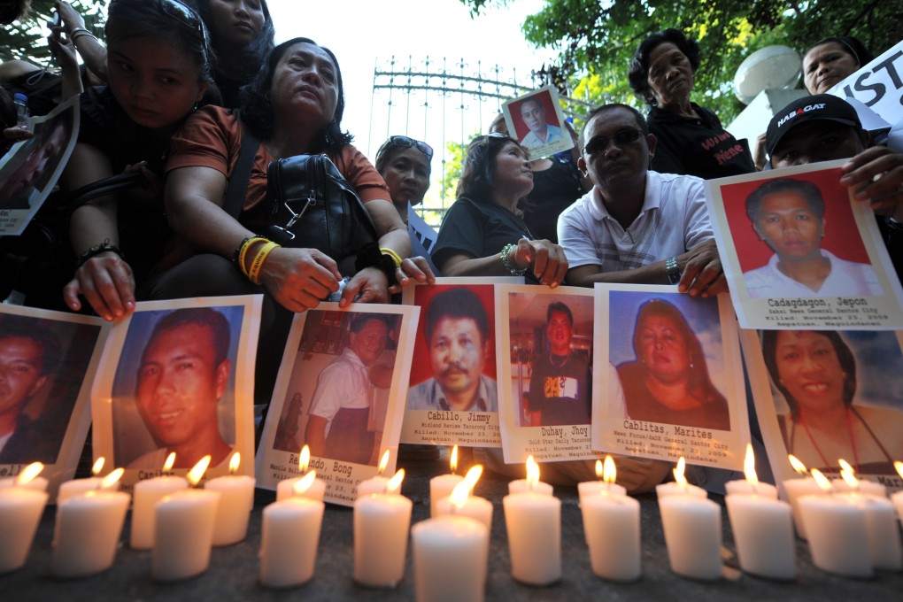 Relatives of 37 journalists killed in the Maguindanao massacre display portraits of their loved ones during a rally in Manila in April 2010. Photo: AFP