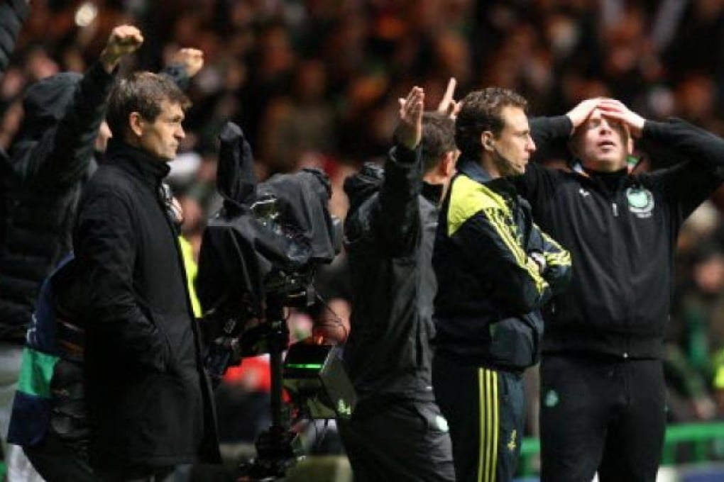 Barcelona manager Tito Vilanova, left, stand's dejected after being defeated by Celtic at the end of their Champions League Group G soccer match at Celtic Park, Glasgow, Scotland on Wednesday. Photo: AP