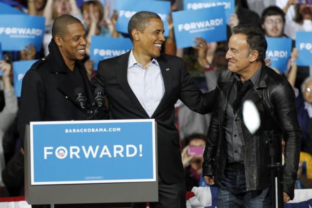 Barack Obama (centre) with supporting celebrities Jay-Z (left) and Bruce Springsteen at a campaign event in Columbus, Ohio.