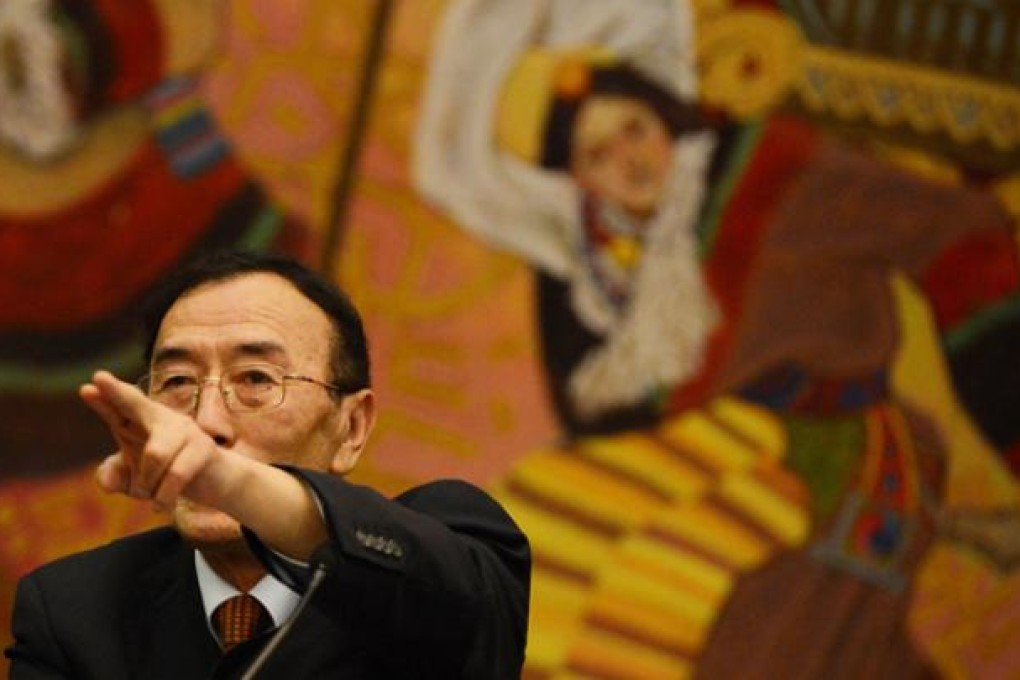 Qiangba Puncog, chairman of China's Tibet Autonomous Region, gestures during a press conference at the Great Hall of the People in Beijing on Friday. Photo: AFP
