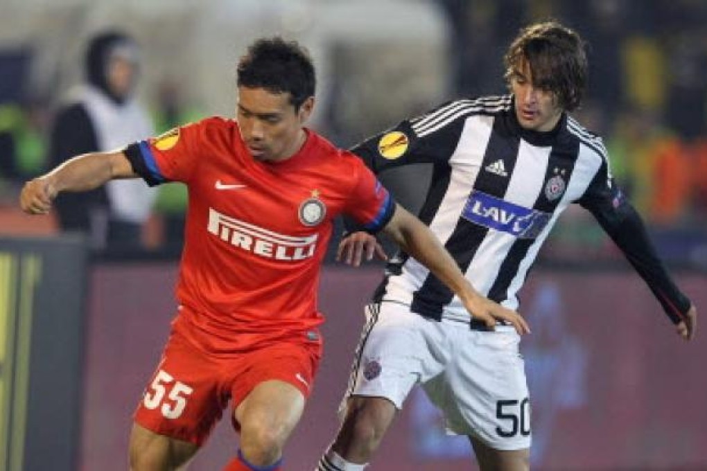 Inter Milan's Yuto Nagatomo (left) fights for the ball with Partizan's Lazar Markovic (right) during their UEFA Europa League group match in Belgrade on Thursday. Photo: EPA
