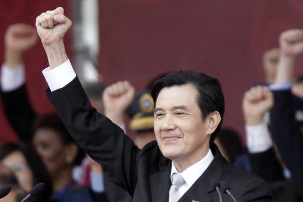 Taiwan's President Ma Ying-jeou raises his fist during National Day celebrations in front of the presidential office in Taipei on October 10. Photo: Reuters