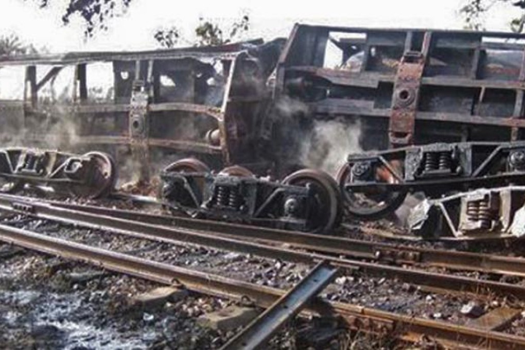 Burnt-out wagons at the site of a train derailment and an ensuing blaze that killed 25 people and injured nearly 100 more in northern Myanmar. Photo: AFP