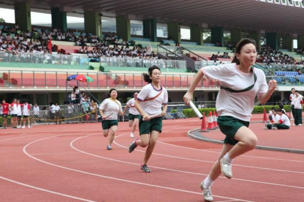 Students race to the finishing line at Wan Chai Sports Ground.