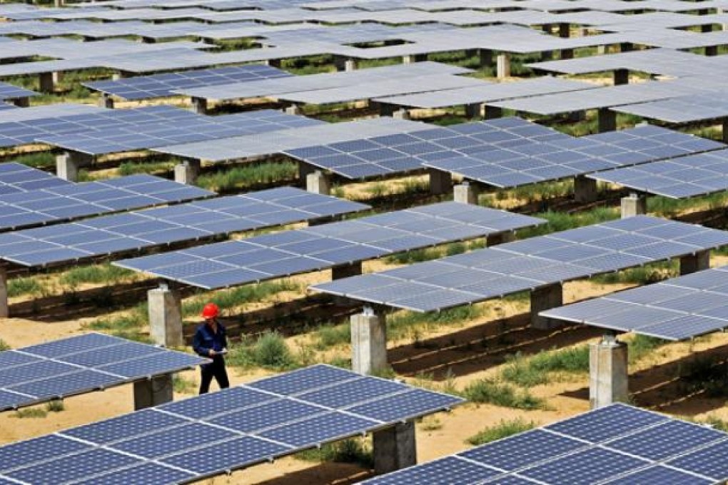 A staff worker patrols at a photovoltaic power station in northwest China's Ningxia Hui Autonomous Region. Photo: Xinhua