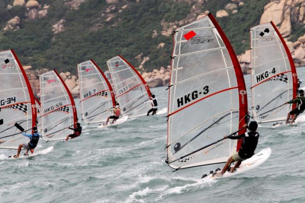 Enthusiastic sailors take advantage of breezy conditions to compete on the final day of the Hong Kong Open windsurfing competition in Cheung Chau yesterday. Photo: Felix Wong
