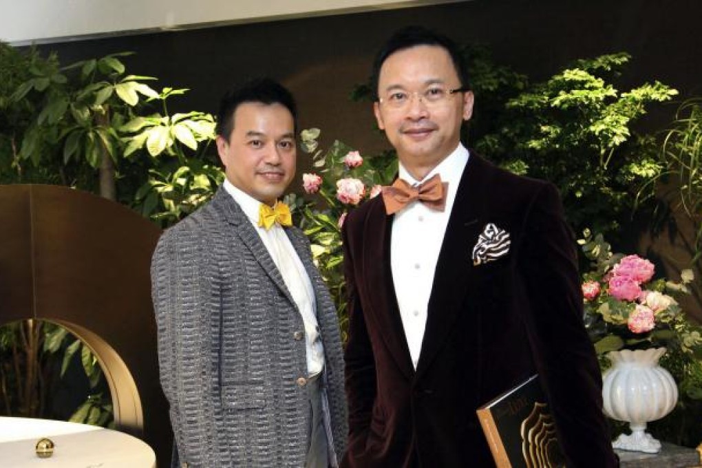 Terence Ngan, left, and Ed Ng unveil the new-look studio and book
