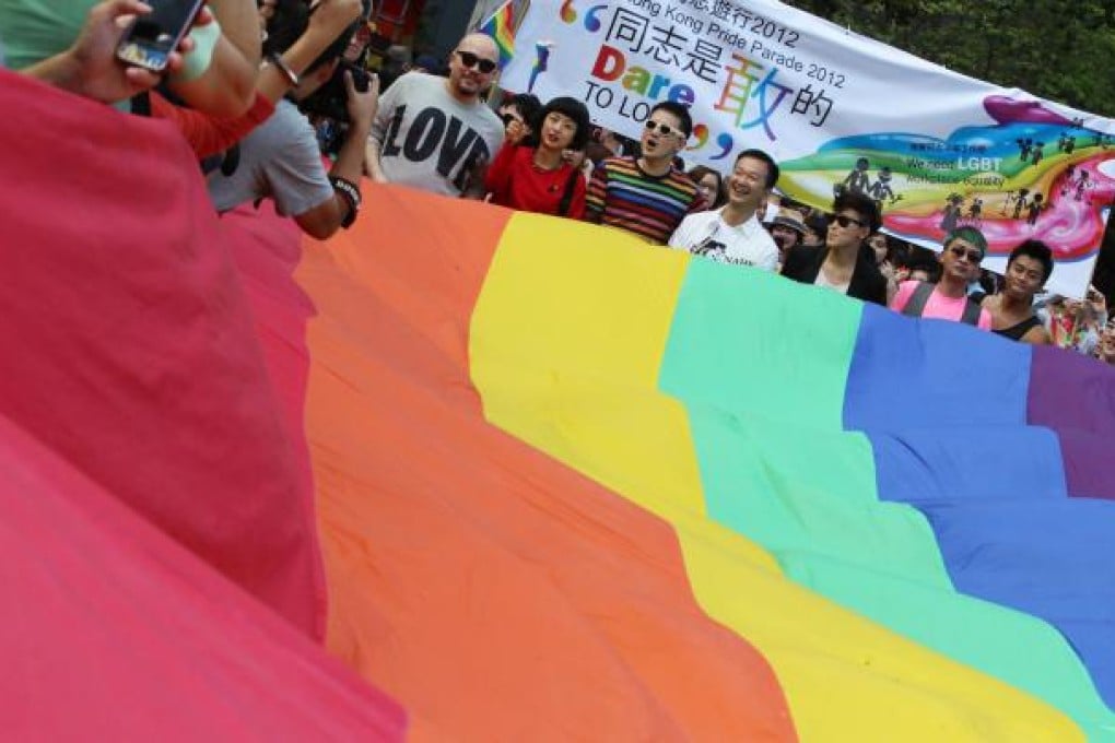 Gay lawmaker Raymond Chan Chi-chuen (centre) and singer Denise Ho (to his left), who came out at the rally, join other artists on the march from Victoria Park to Central to demand equal rights for people of all sexual persuasions. Photo: Nora Tam