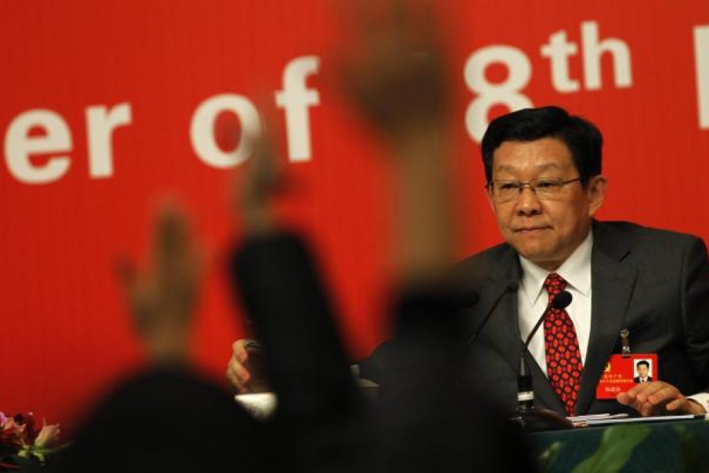 Commerce Minister Chen Deming speaks to the press. Photo: EPA