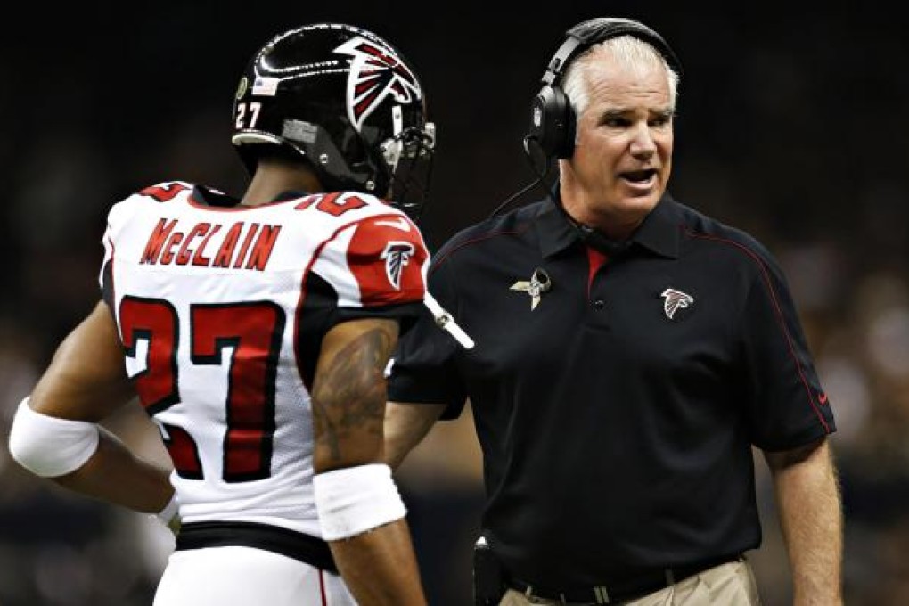 Falcons coach Mike Smith (right)