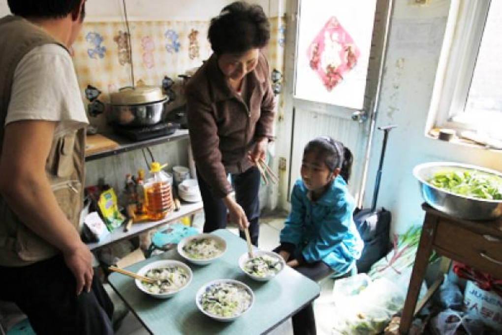 A family living in Beijing. About 500 million peasants are expected move from the countryside to cities in the next 20 years. Photo: AP