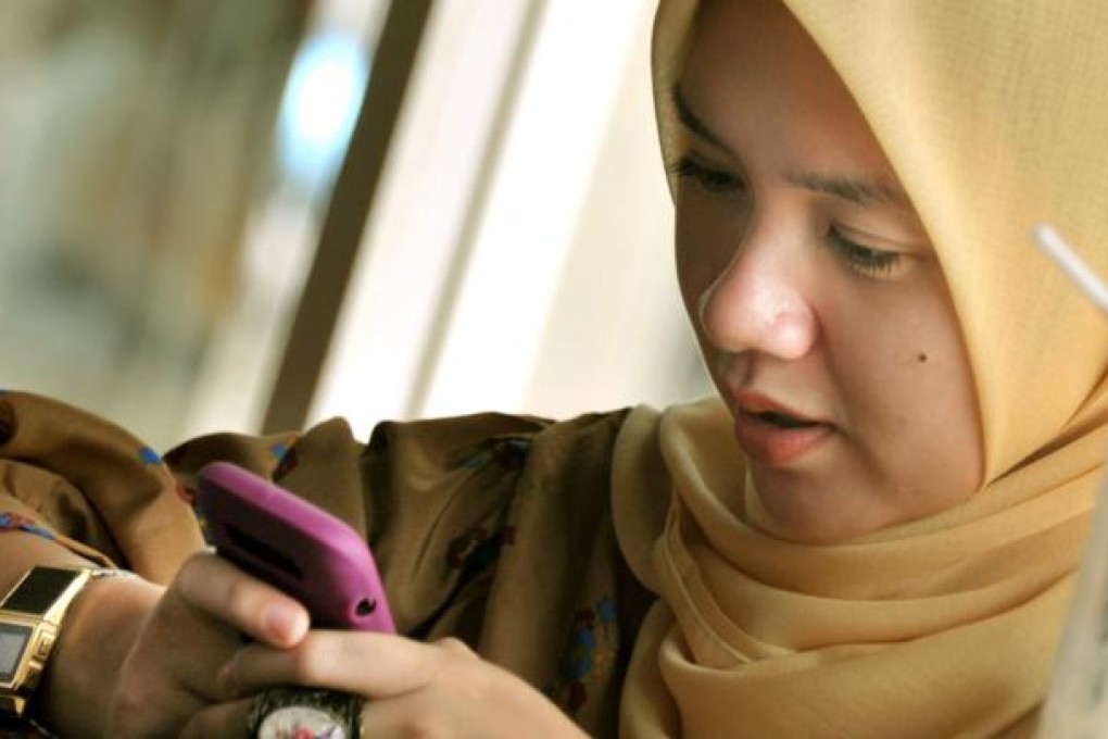 In the Philippines and Indonesia, women are increasingly using social media technology to expand their opportunities in business and politics. Photo: AFP