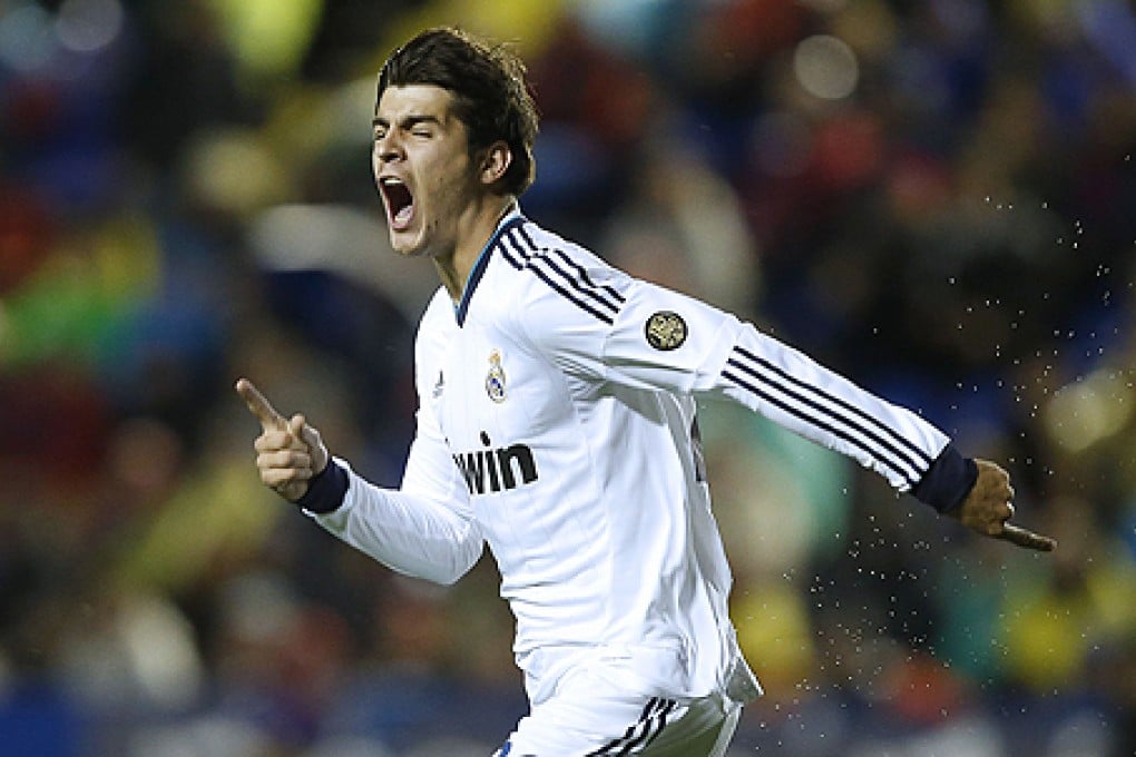 Real Madrid forward Alvaro Morata celebrates after scoring in a vital 84th minute header against Levante. Photo: AFP