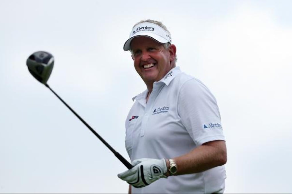 Colin Montgomerie of Scotland tees off on the ninth hole during the second round of the Singapore Open golf tournament at the Serapong Course at Sentosa Golf Club in Singapore on Saturday Nov. 10, 2012. Photo: AP+