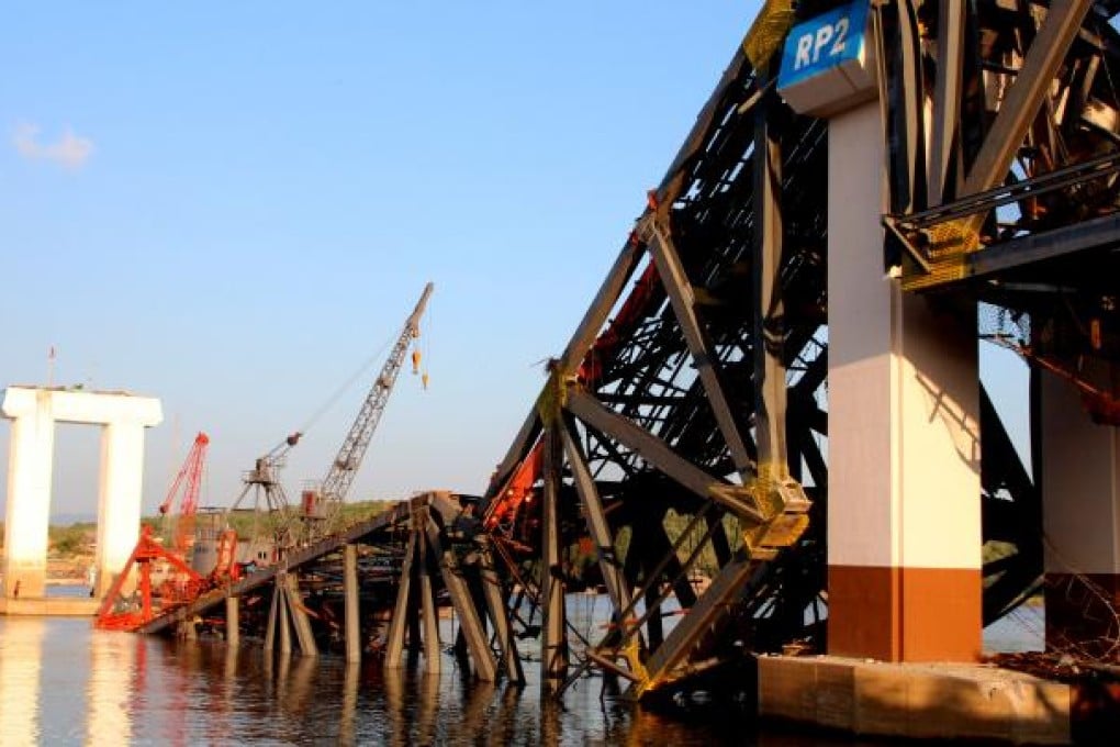 The collapsed bridge over the Irrawaddy River, still under construction, after the earthquake. Photo: Xinhua