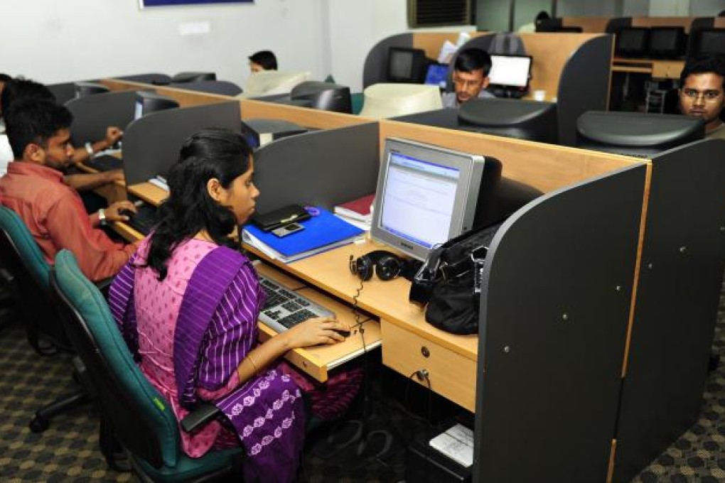 Programmers at work in a software firm in Dhaka, Bangladesh. Upgrading the service sector could play a critical role in the future growth of Asia. Photo: AFP