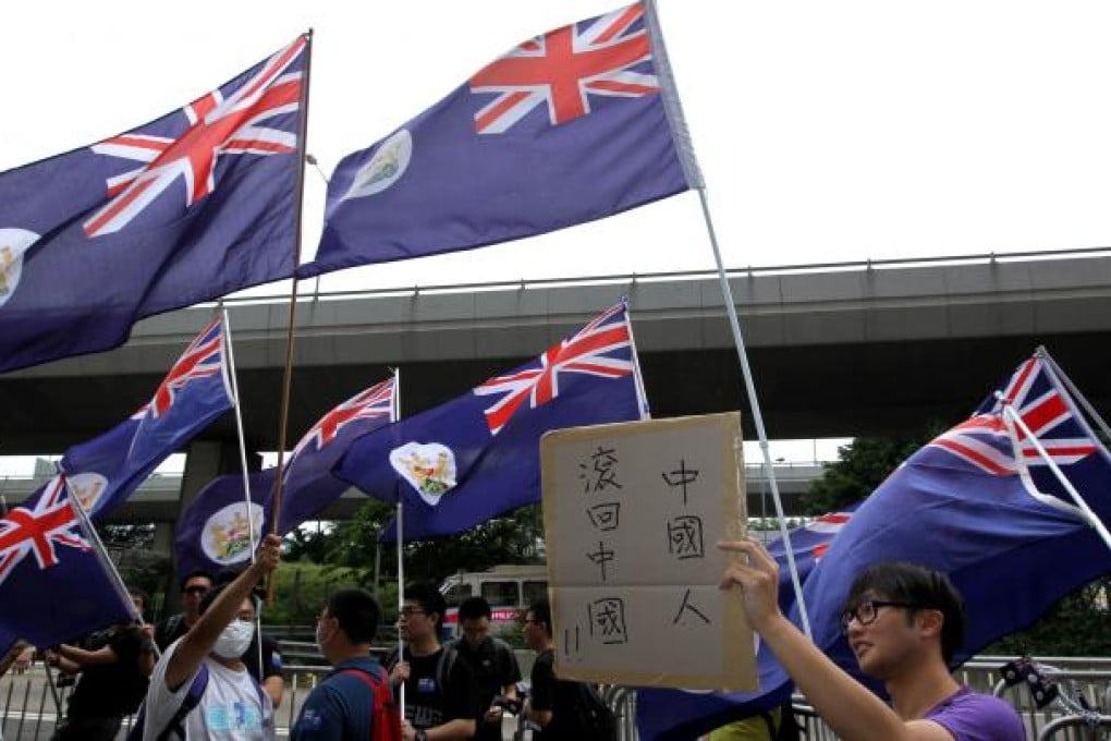 Protesters fly colonial Hong Kong flags. Photo: Dickson Lee