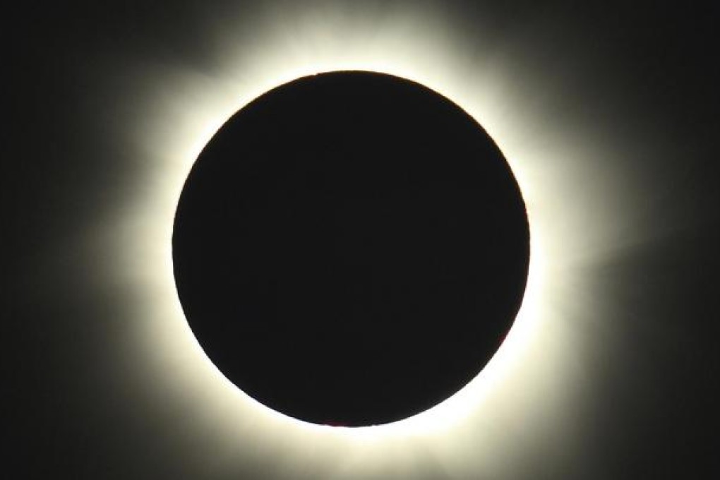 Starting just after dawn, the eclipse cast a shadow 150 kilometres long. Photo: AP/Tourism Queensland