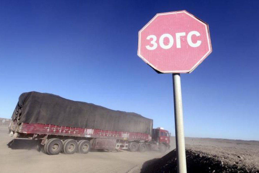 Coal trucks leave the SouthGobi Resources mine in Ovoot Tolgoi, Mongolia. Photo: Bloomberg