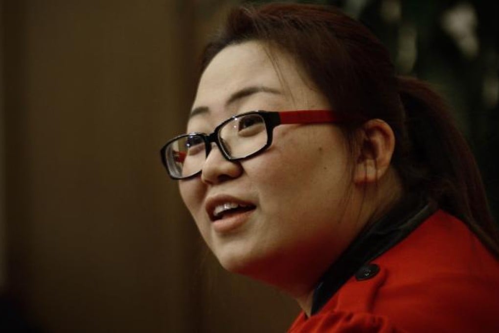 A delegate from Guangdong province, Yan Wenjing answers questions at an interview during the 18th Communist Party Congress in Beijing on November 12, 2012. Photo: AFP