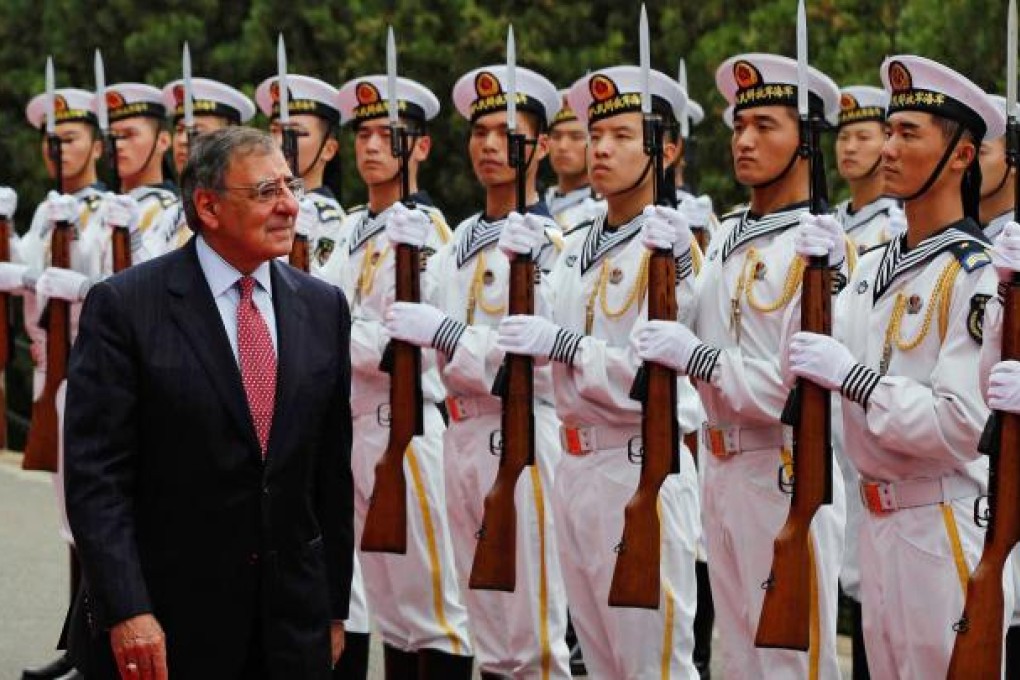 US Defence Secretary Leon Panetta reviews a naval honour guard in Qingdao before touring vessels of China's North Sea Fleet, during a visit to the country in September. Photo: AFP