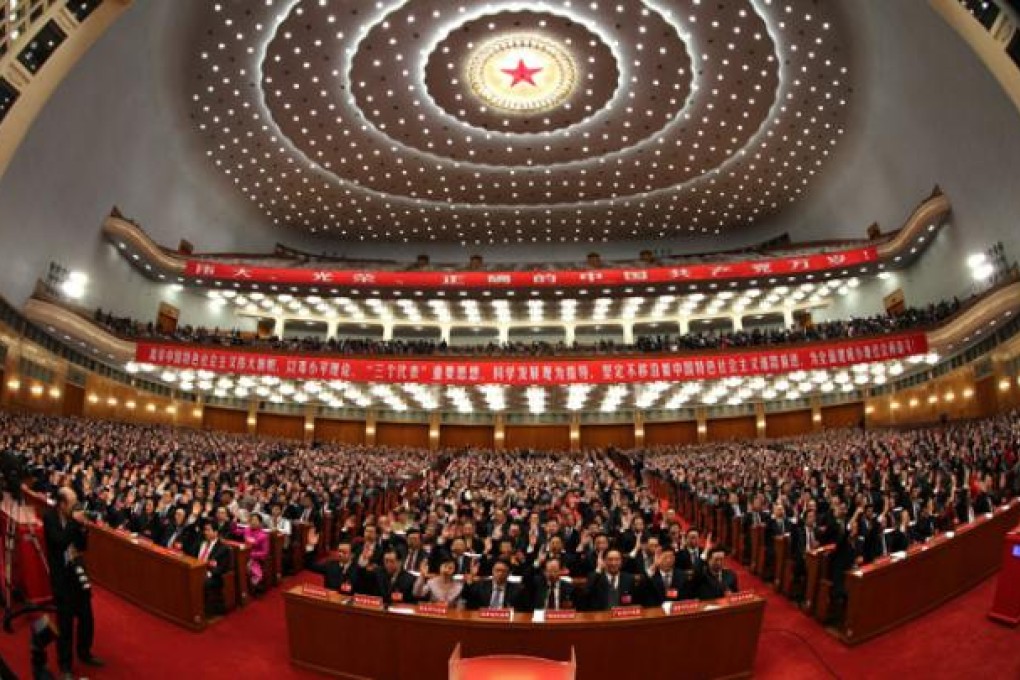 Delegates attend the closing session of the 18th National Congress of the Communist Party of China at the Great Hall of the People in Beijing on Wednesday. Photo: Xinhua