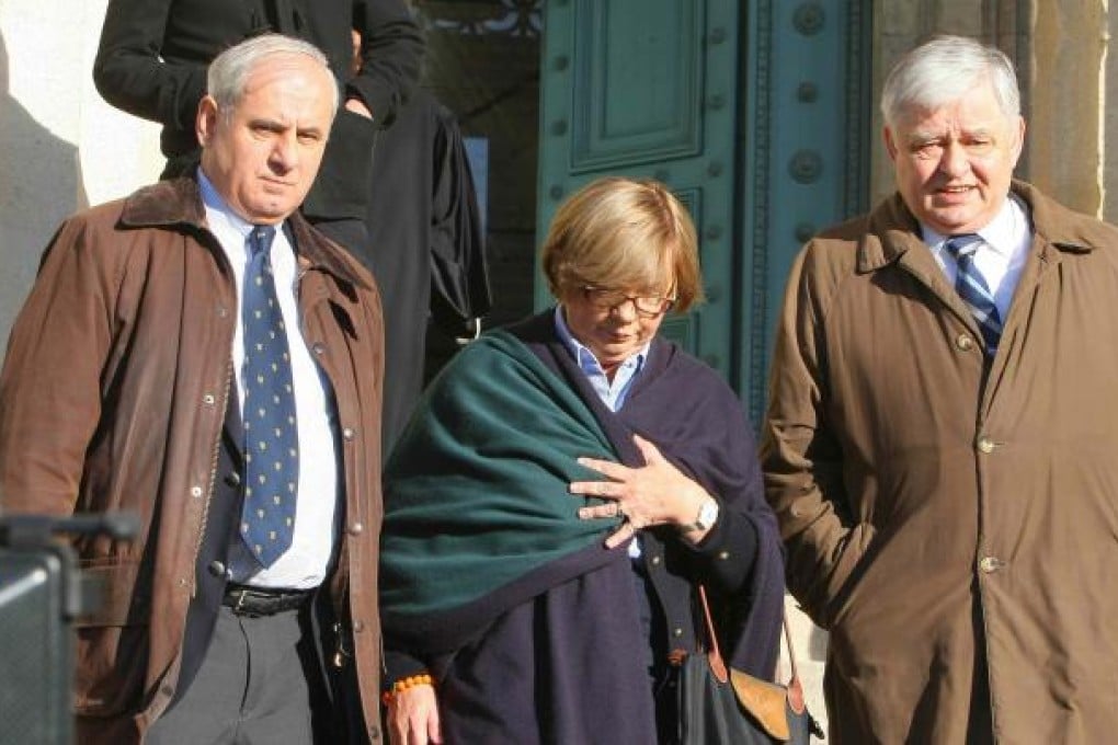 Christine de Vedrines (centre) and Philippe de Vedrines (right) as they leave the Bordeaux court on Tuesday. Photo: AFP