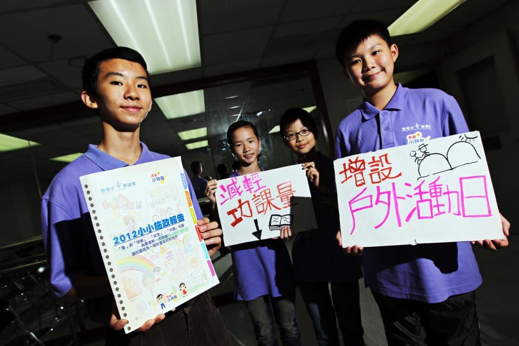 Junior Chief Executives Simon Wong, Alicia So, Ronny Fung and Anson Lam show their proposals. Photos: May Tse, Nora Tam