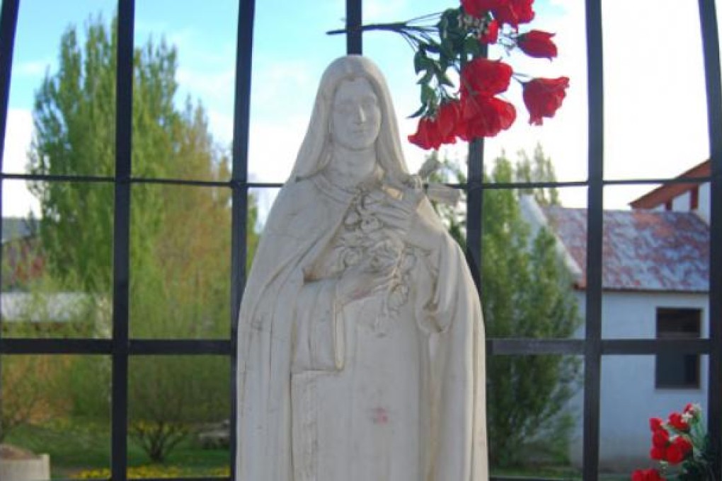 A statue of Mother Mary at a church in the charming town of El Calafate.