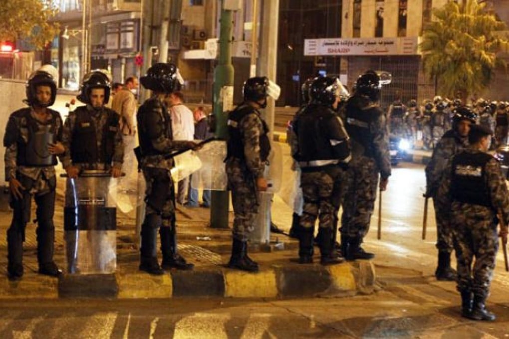 Jordanian anti-riot police stand guard during a protest against rising fuel costs, at Jabal al-Hussein in Amman on Thursday. Photo: EPA